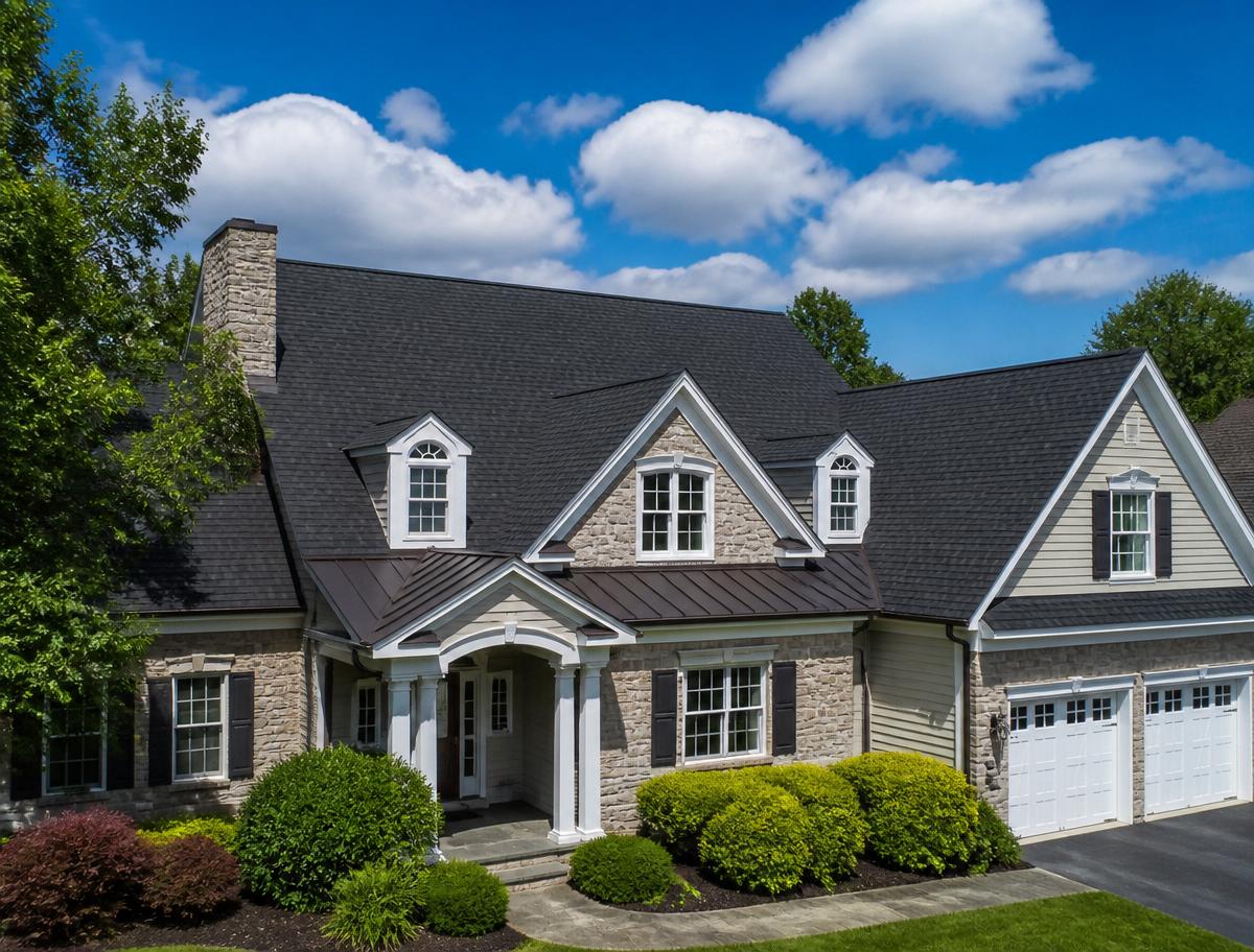 New dark architectural shingle roof on a stone home